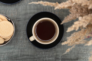Mug of black coffee. Keep warm. Autumn mood.