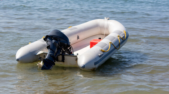 Rubber boat with a motor on the sea.