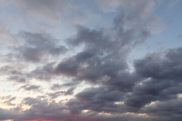 Naklejka na ściany i meble Clouds in the sky at sunset