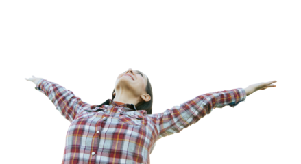 Young girl spreading hands with joy. Open arms looking up to the sky.