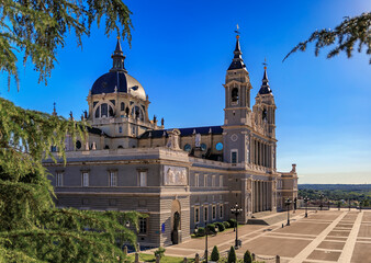 Fototapeta na wymiar Aerial view of the Cathedral of Our Lady of La Almudena and Plaza de la Armeria in Madrid, Spain, consecrated by Pope John Paul II in 1993