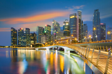 Fototapeta na wymiar Sunrise at Singapore cityscape. Landscape of Singapore business building with Jubilee bridge at dusk. Aerial view of modern high building in central business district area around Marina Bay.