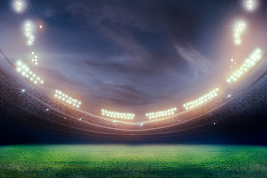 Green soccer field, bright spotlights