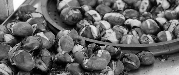 Freshly Roasted Chestnuts Vendor cart in Istanbul, Turkey. Selective Focus. Black and white