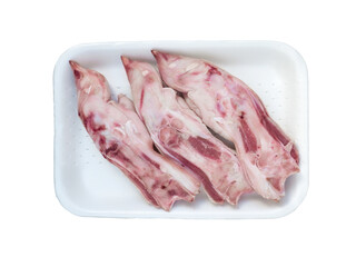 Pork feet in the white tray isolated transparent png top view. Legs for the preparation of jelly.