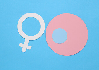 Ovulation. Women Health. Venus female gender symbol with ovum model on blue background