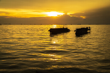 sunset at sea with silhouette of boat. beautiful sunset sky. sea landscape.