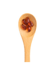  pills in wooden spoon