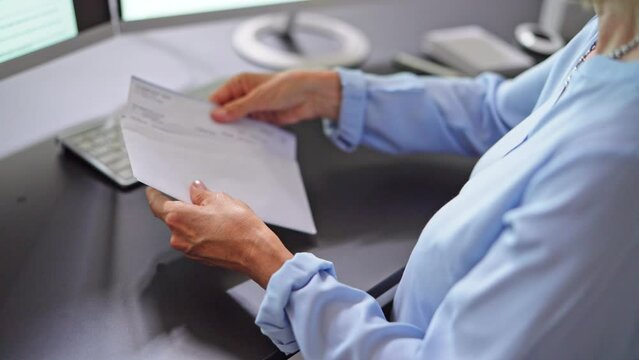 Paycheck In Envelope. Opening Payroll Check