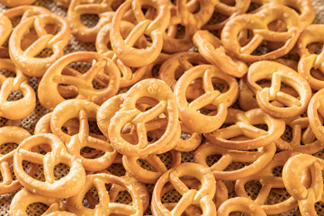 the background is filled with pretzels, a pattern of pretzels randomly distributed over the entire surface