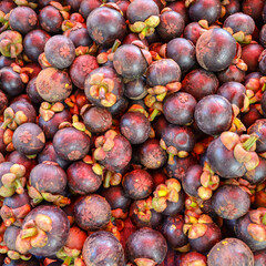 Mangosteen background, this is a very popular fruit in Asia. It is call The Queen of fruits
