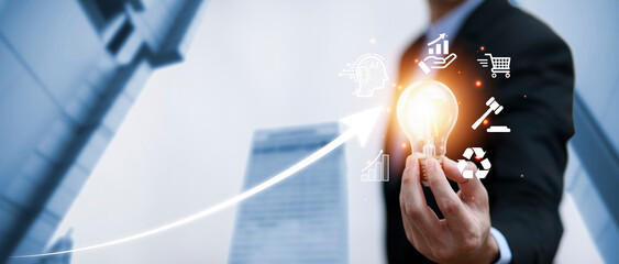 Double exposure of business hand holding light bulb with line connect and working on desk, Creativity and innovation are keys to success.Concept of new idea and innovation with energy and power.