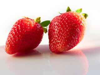 Fresh, red and delicious strawberries, on a white background