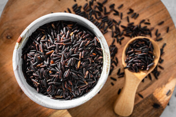 Black rice, also known as purple rice or forbidden rice. Organic unpolished black rice grains as a source of complex carbohydrates and high in antioxidants.  