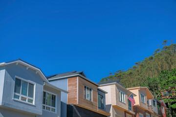 Fototapeta na wymiar Colorful homes in San Francisco California neighborhood with blue sky background