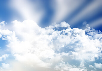 Blue sunny sky background with fluffy white clouds