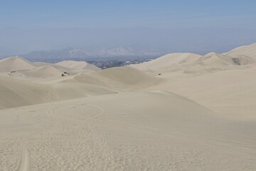 Fototapeta na wymiar sand dunes in the desert of Huacachina, Peru 