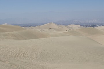 Fototapeta na wymiar sand dunes in Huacachina desert, Peru