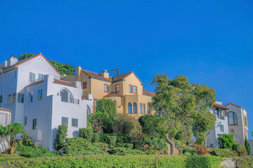 Fototapeta na wymiar San Francisco California neighborhood with houses against clear blue sky