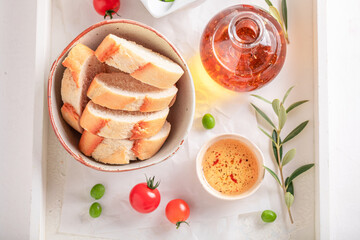 Fresh baguette with tomatoes, herbs and olive oil.