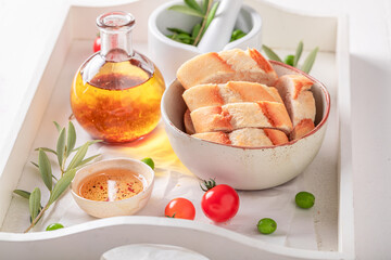 Fresh bread served with tomatoes oil with herbs.