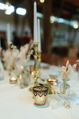 Elegant table setting and decoration for a dinner at a wedding location