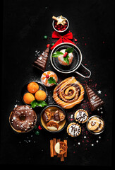 Christmas tree with sweets and cookies decoration on dark background.