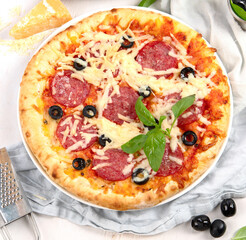 Freshly baked pizza on dark background.