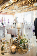 Elegant table setting and decoration for a dinner at a wedding location