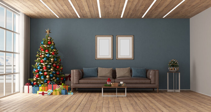 Modern living room with Christmas tree and leather sofa