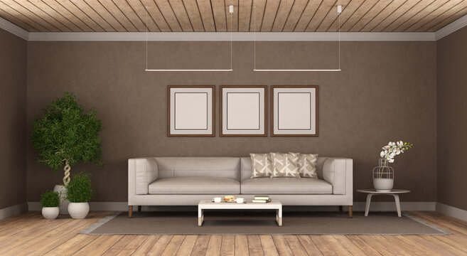 Poster mockup in a brown living room with white sofa