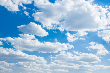 White clouds in the blue sky. The sky as a background for your image.