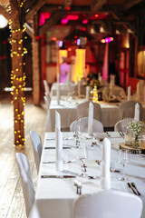 Elegant table setting and decoration for a dinner at a wedding location