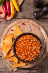 Chili beans on wooden table background. Kidney beans and vegetable Mexican food. 