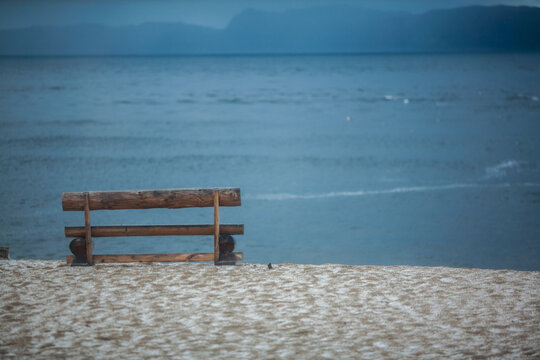 Wooden bench on the beach © maodoltee