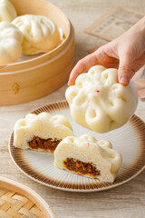 Baozi or bao, is a type of yeast-leavened filled bun in various Chinese cuisines. There are many variations in fillings, though the buns are most often steamed. 
