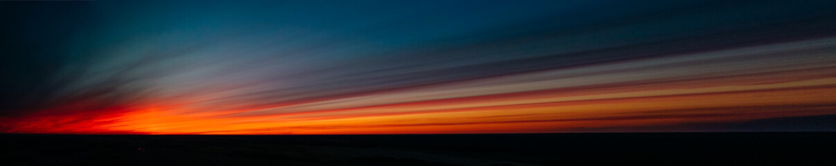 red sunset in dark clouds