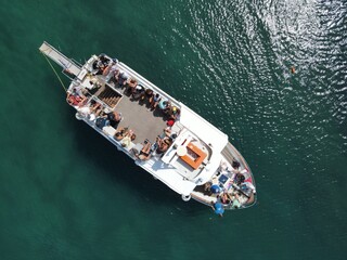 aerial view of cruise taxi boat transport tourists from sivota in epirus to ionian islands in greece