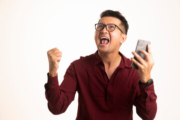 Smart Asian man using smartphone in studio background, handsome young Asian man smiling happily in formal shirt. using a smartphone to exchange or chat