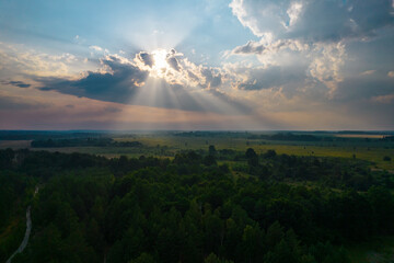 sun rays through dark clouds