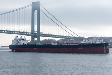 Cargo ship, oil tanker, sailing under the Verrazzano-Narrows Bridge, on her way to the New York Bay.