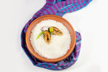 ilish panta Bengali new year festive dish. Boishakh panta ilish with green chilli and onion. Panta bhat is popular among Bengali's in India and Bangladesh. with gamcha.