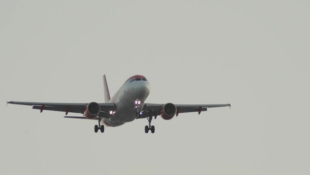 Close-up of the plane landing at the airport. Slow motion video of a passenger plane flying in for landing. High quality 4k footage