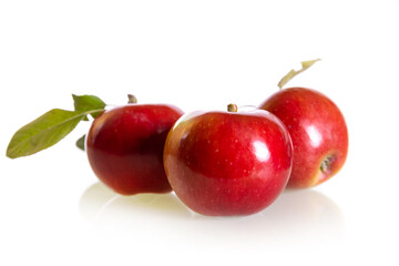 Three fresh red apples isolated on a white background