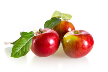 Three fresh red apples isolated on a white background