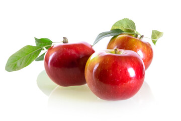 Three fresh red apples isolated on a white background