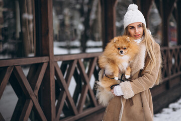 Woman with dog in winter