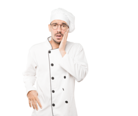 Concerned young chef doing a gesture of relief