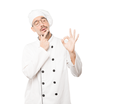 Worried young chef doubting and making a gesture of approval