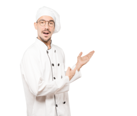 Amazed young chef making a gesture of welcome